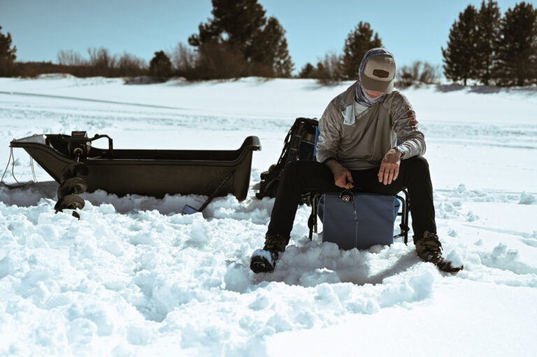 Vista Verde Ranch guide ice fishing in the winter