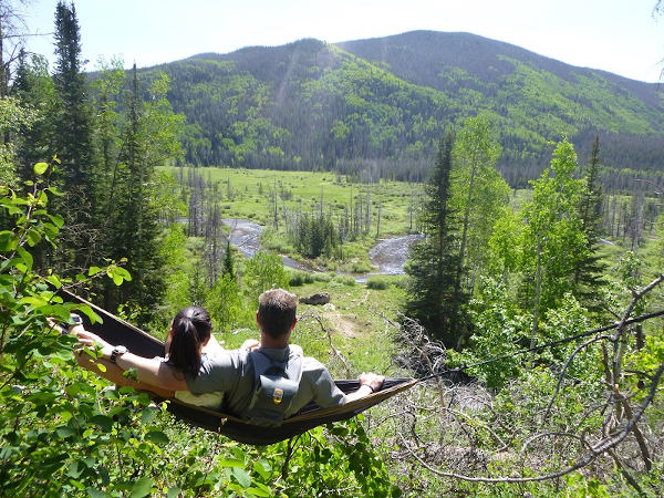 hammock vacation in Colorado guests relaxing in a hammock on a Colorado ranch vacation