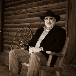 man sitting on a front porch