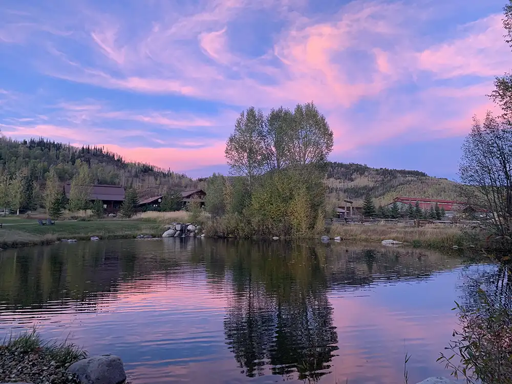 The pond sits beside the outdoor patio to our main lodge at the center of the ranch