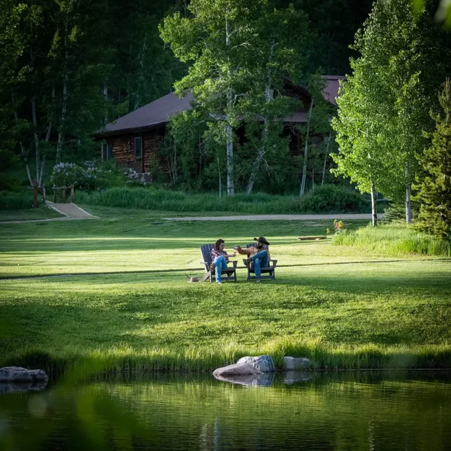 The pond sits beside the outdoor patio to our main lodge at the center of the ranch